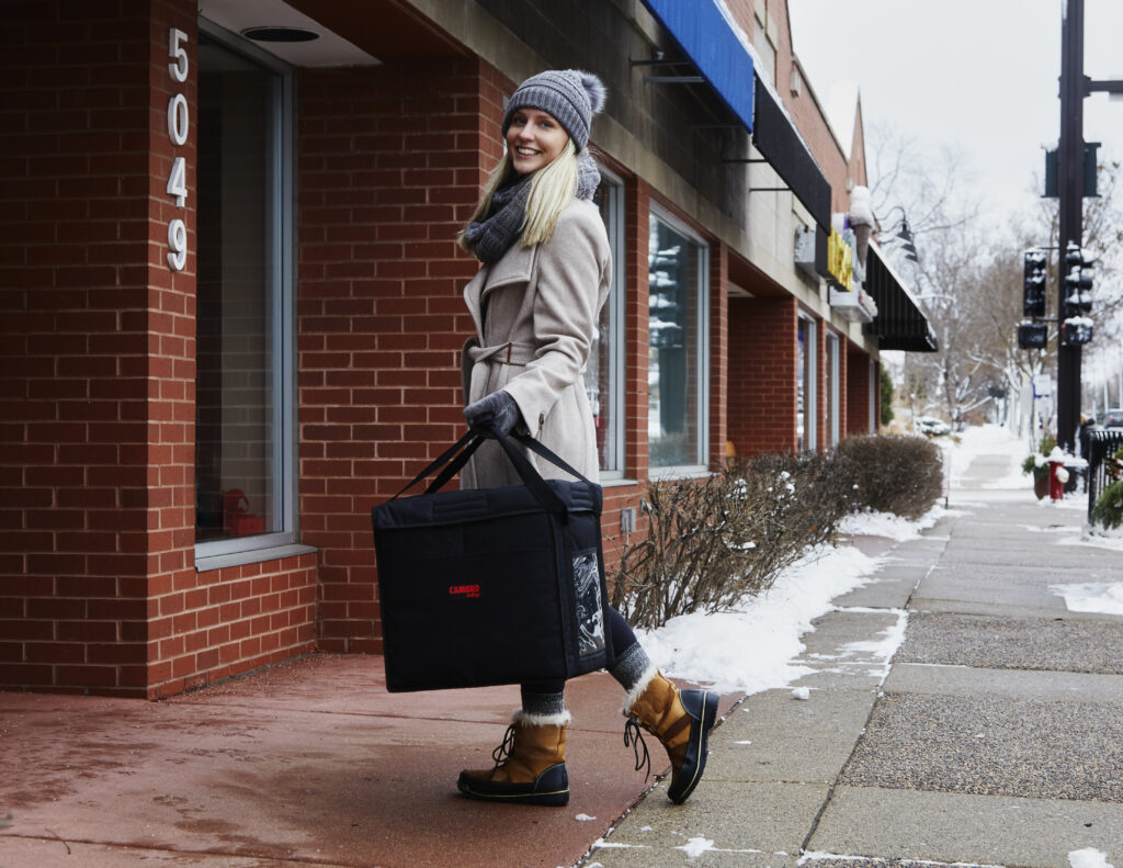 girl with delivery bag in winter