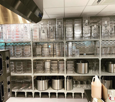 shelving in a commercial kitchen with pans